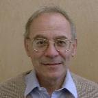man with glasses smiling