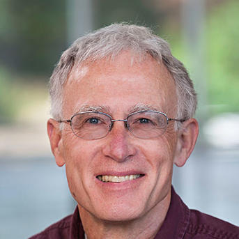 man with glasses smiling
