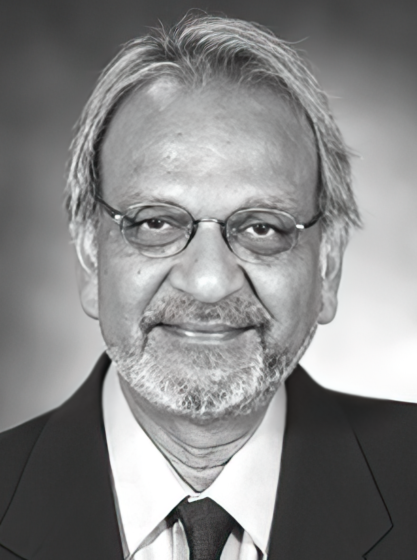 black and white photo of man with glasses