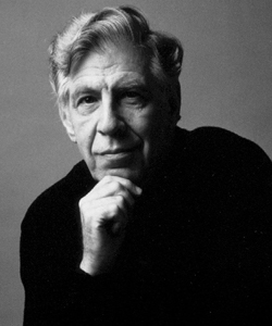 black and white photo of man in a dark top